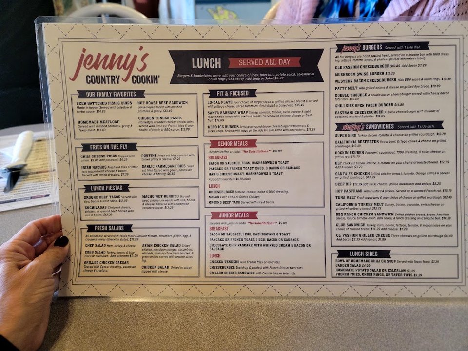 Printed menu with salads, hot plates, and lighter options.