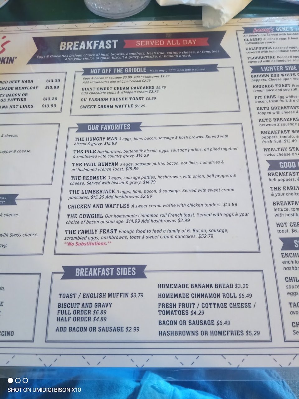 Restaurant menu beside a cup of coffee.
